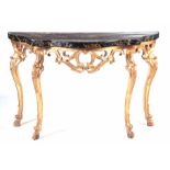 AN 18TH CENTURY CONTINENTAL CARVED GILT GESSO CONSOLE TABLE with black scumbled faux marble top