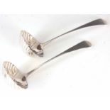 A PAIR OF GEORGE III SAUCE LADLES with shell style bowls and plain handles 17.5cm long, app. 3