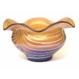 A 20TH CENTURY IRIDESCENT ART GLASS BOWL, decorated with white trailing swags and gold interior,