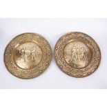 A PAIR OF 18TH CENTURY BRASS ALMS DISHES with engraved and punched decoration one depicting Adam &