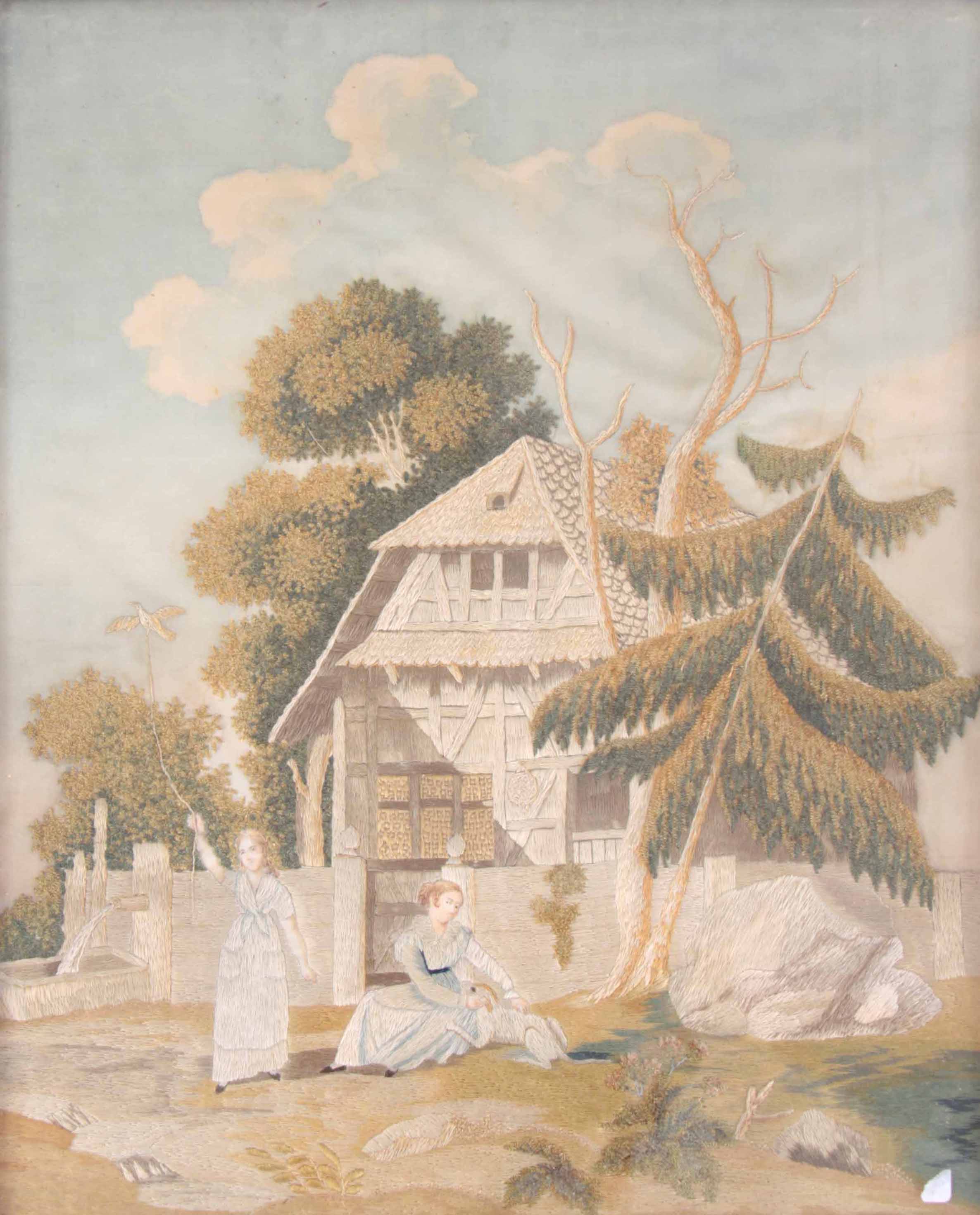 AN 18TH CENTURY STUMPWORK EMBROIDERY ON SILK depicting two girls playing in a garden in front of a