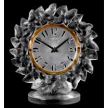 R. LALIQUE A ROITELETS STRUTT CLOCK decorated with a band of birds, on a circular base - impressed