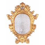 AN 18TH CENTURY CARVED GILT GESSO CONTINENTAL HANGING MIRROR with rococo shaped leaf moulded