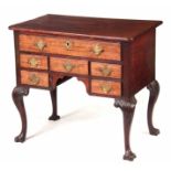 A MID 18TH CENTURY FIGURED MAHOGANY IRISH LOWBOY / SIDE TABLE with unusual drawer configuration of