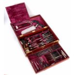 A FINE SET OF SURGICAL INSTRUMENTS IN A BRASS BOUND MAHOGANY BOX the fitted velvet lined interior