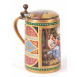 AN EARLY 20TH CENTURY ROYAL VIENNA PORCELAIN LIDDED TANKARD “Amor u. Psyche” with gilt metal front