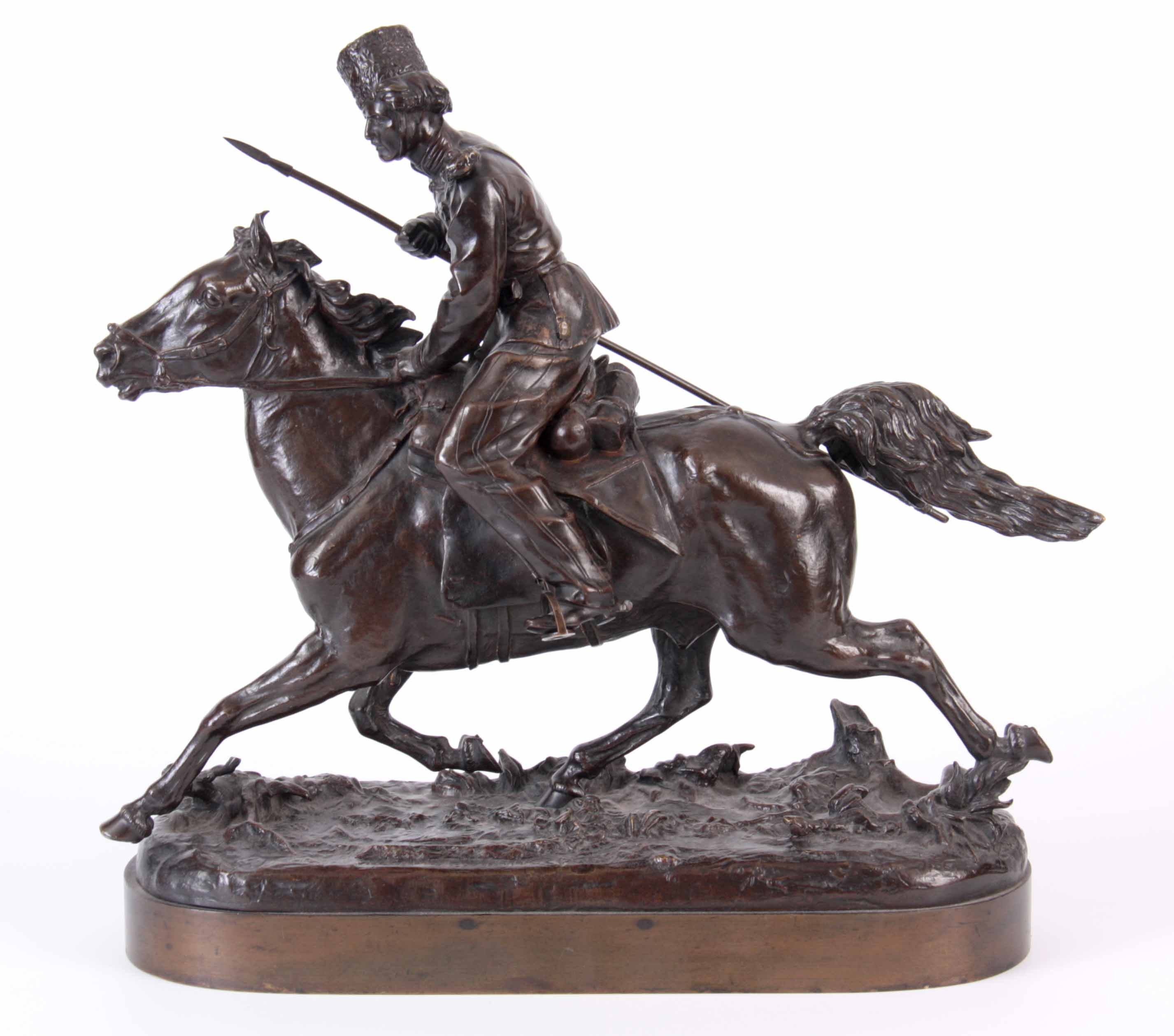 E. NAHCEPE. A LATE 19TH CENTURY RUSSIAN PATINATED BRONZE SCULPTURE modelled as a Cossack on charging