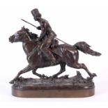 E. NAHCEPE. A LATE 19TH CENTURY RUSSIAN PATINATED BRONZE SCULPTURE modelled as a Cossack on charging