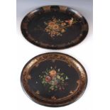 A VICTORIAN GILT AND BLACK JAPANNED OVAL PAPIER MACHE TRAY with painted flower spray centre and