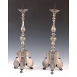 A LARGE PAIR OF 19th CENTURY PEWTER PRICKET CANDLESTICKS having circular sconces on turned columns