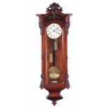 A LATE 19TH CENTURY GERMAN WALNUT VIENNA STYLE WALL CLOCK the case with detachable carved pediment