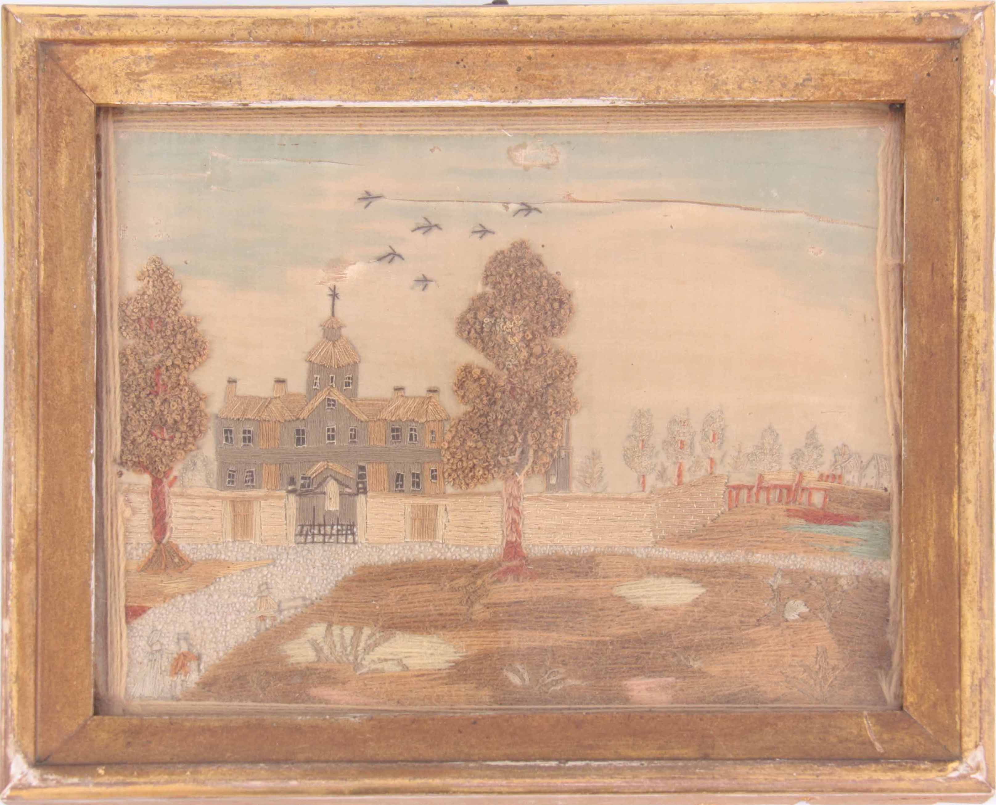 AN 18TH CENTURY STUMPWORK EMBROIDERY ON SILK depicting a large country house done in long stitch,