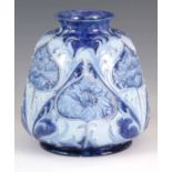 A FLORIAN WARE MOORCROFT VASE with stylised piped floral decoration with a printed label for '