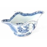 AN 18TH CENTURY CHINESE BLUE AND WHITE PORCELAIN DOUBLE SIDED GRAVY BOAT decorated with flowers -