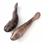 A PAIR OF EARLY 20th CENTURY CONTINENTAL SILVER ARTICULATED FISH having inset red glass eyes and
