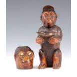 A LATE 19TH CENTURY BLACK FOREST CARVED MONKEY PIN TRAY AND PIPE STAND the pin tray formed as a