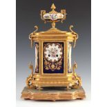 A LATE 19TH CENTURY FRENCH ORMOLU AND PORCELAIN PANEL MANTEL CLOCK the gilt brass case with chased