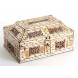 AN EARLY 19TH CENTURY RUSSIAN STAINED AND CARVED BONE CASKET having finely carved pierced panels and