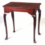 A MID 18TH CENTURY MAHOGANY SILVER TABLE with later top, having a shaped frieze; standing on