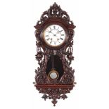 LENZKIRCH. A LATE 19TH CENTURY GERMAN VIENNA STYLE WALL CLOCK the mahogany serpentine case profusely