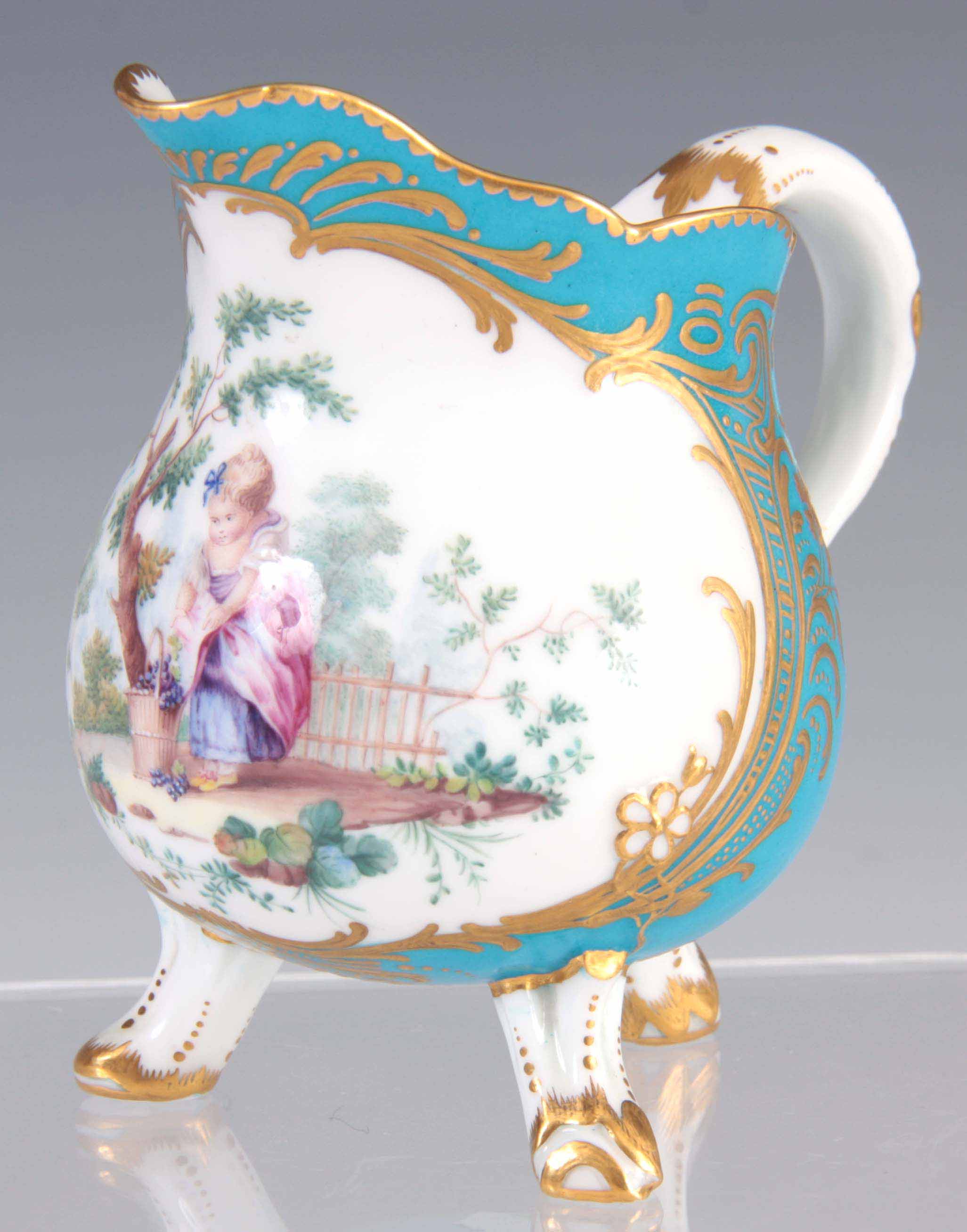 A FINE 19TH CENTURY SEVRES PORCELAIN CREAM JUG of shaped form standing on three branch work feet,