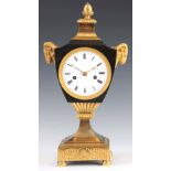 AN EARLY FRENCH BRONZE AND ORMOLU URN SHAPED MANTEL CLOCK the patinated case flanked by two gilt