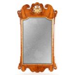 A MID 18TH CENTURY WALNUT AND GILT GESSO HANGING WALL MIRROR with carved feather crest and