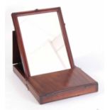 A GEORGE III MAHOGANY FOLDING GENTLEMANS CAMPAIGN MIRROR with hinged box surround revealing an