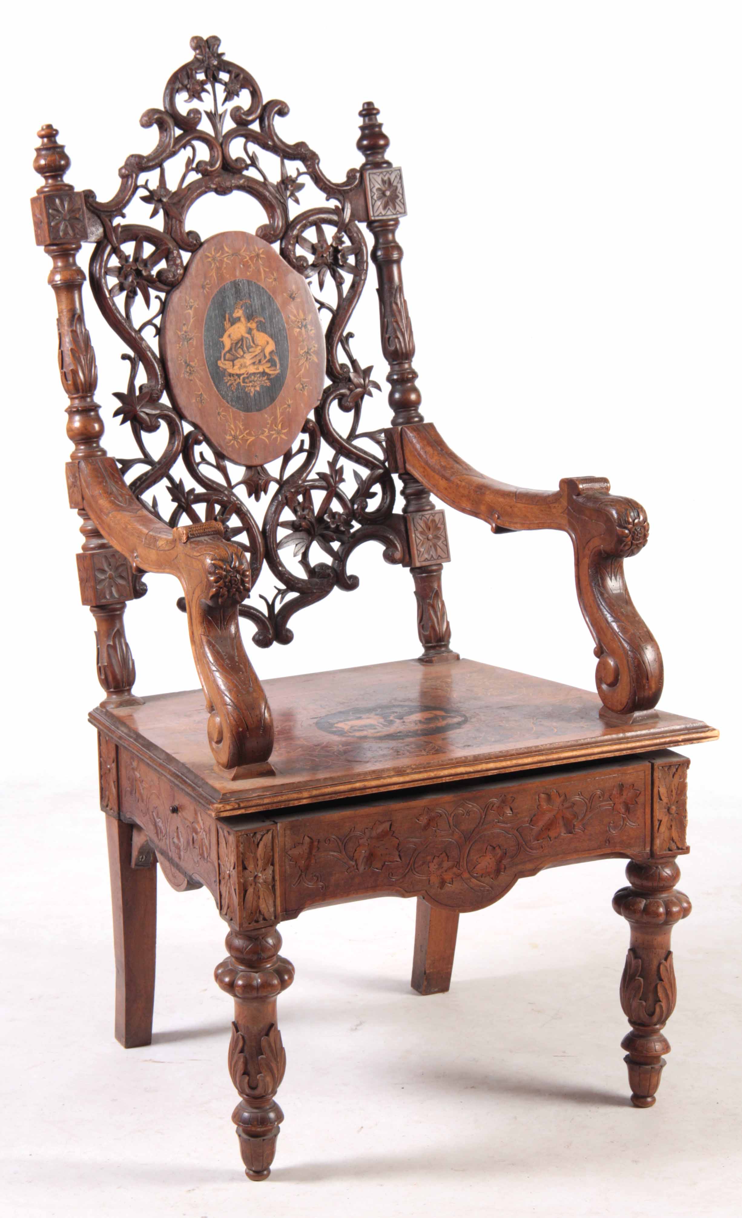 A 19TH CENTURY WALNUT BLACK FOREST MUSICAL ARMCHAIR with marquetry inlaid panels surrounded by