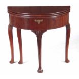 A GEORGE II TRIPLE TOP D SHAPED GAMES TABLE with folding tops revealing a tea table, games table