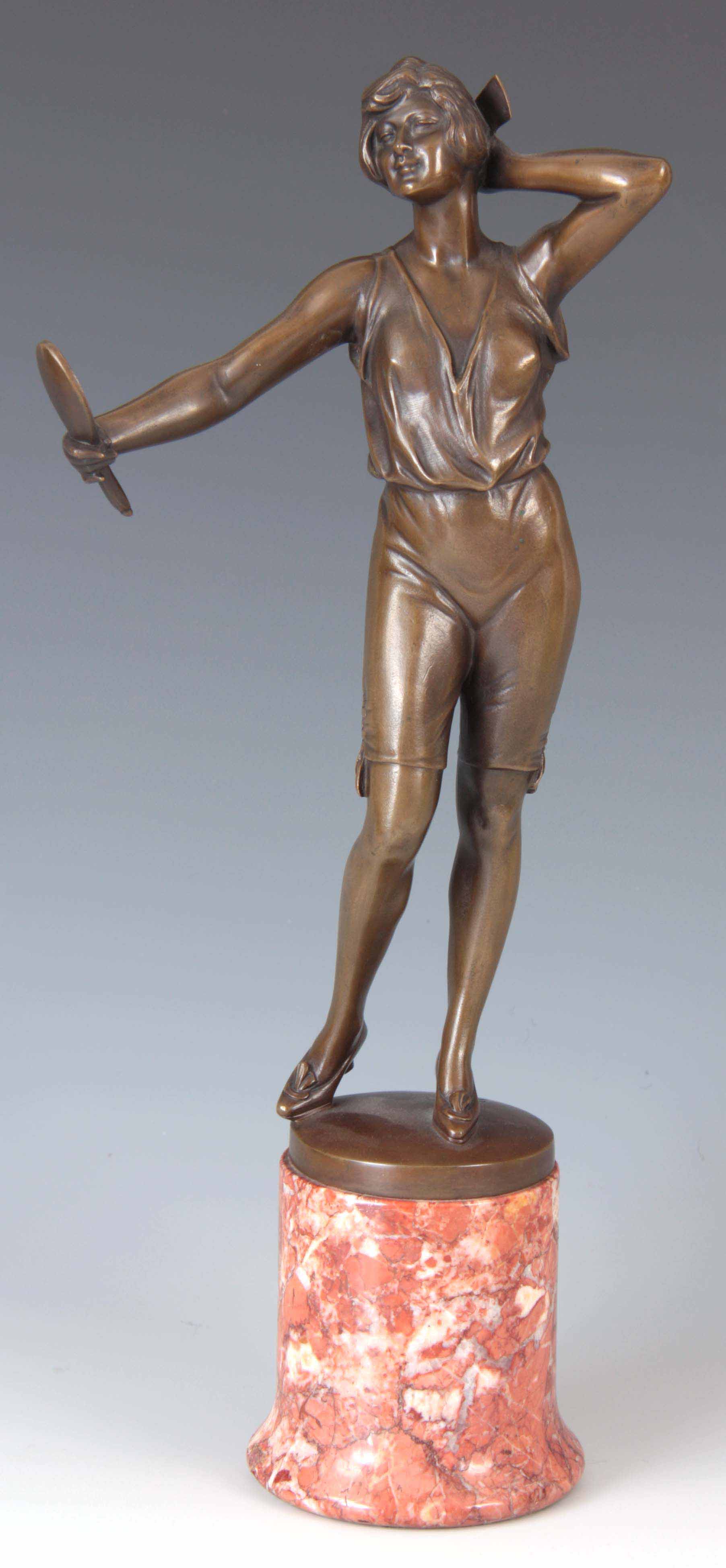 BRUNO ZACH. AN EARLY 20TH CENTURY AUSTRIAN BRONZE SCULPTURE modelled as a young woman looking into a