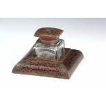 A LATE 19TH CENTURY TORTOISESHELL AND BRASS BOULLE INK STAND the heavy cut glass inkwell having a