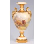 HARRY STINTON – A ROYAL WORCESTER GILT AND IVORY GROUND TWO HANDLED OVOID PEDESTAL CABINET VASE