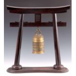 A 19TH CENTURY CHINESE HARDWOOD DINNER GONG formed as a pagoda, having a hanging cast brass bell