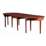 A GEORGE III FIGURED MAHOGANY D END DINING TABLE with three sections comprising of two D ends and