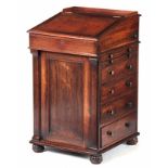 AN EARLY 19TH CENTURY ROSEWOOD DAVENPORT IN THE STYLE OF GILLOWS having an adjustable writing