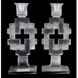 R. LALIQUE A PAIR OF GLASS PAQUERETTES CANDLESTICKS - impressed R. Lalique 23cm high.