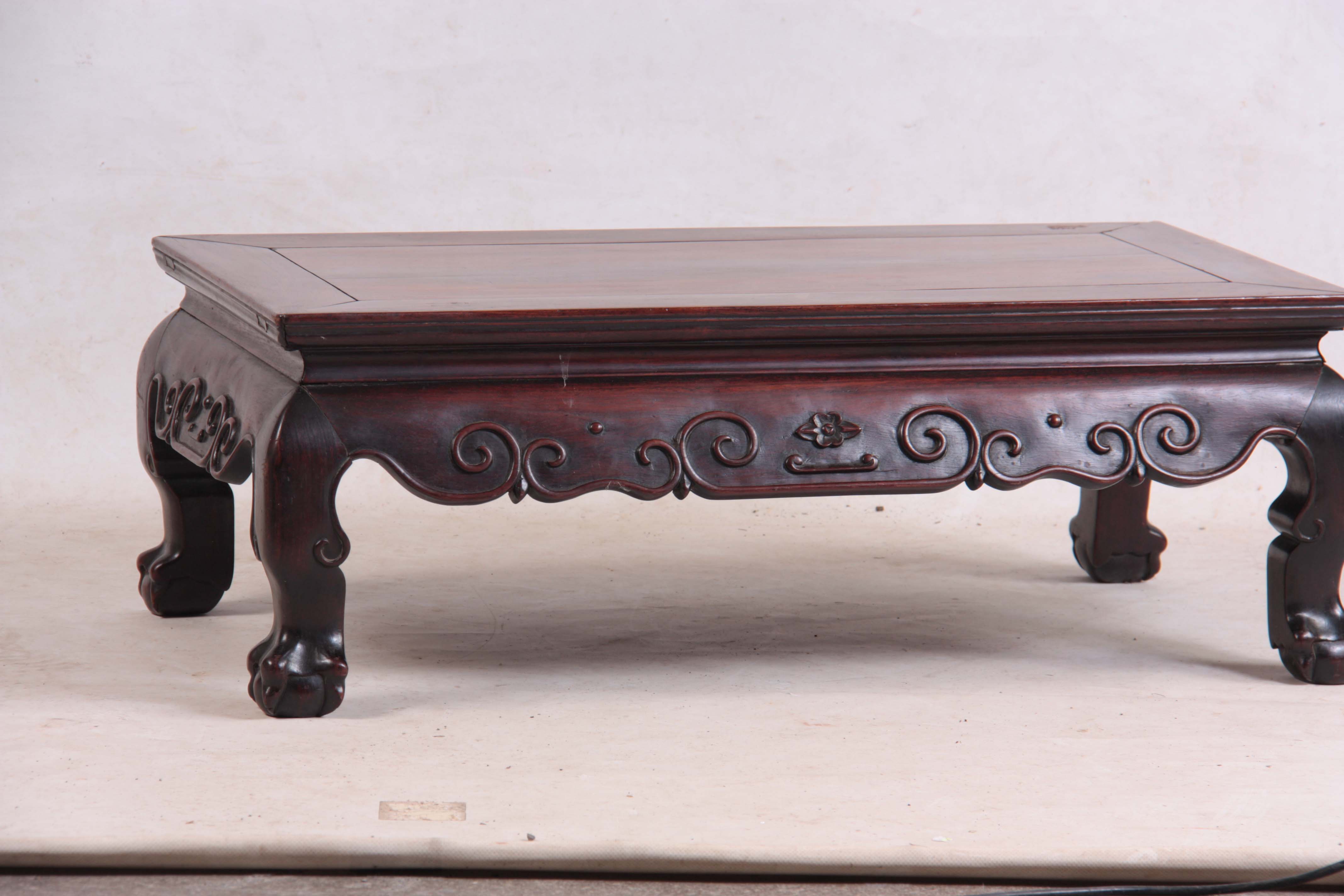 A 19TH CENTURY CHINESE HARDWOOD LOW OCCASIONAL TABLE with panelled top and shaped scroll carved base - Image 2 of 5