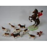 A Beswick part hunting set comprising; Rearing huntsman, Eight hounds and a fox. Condition: Broken