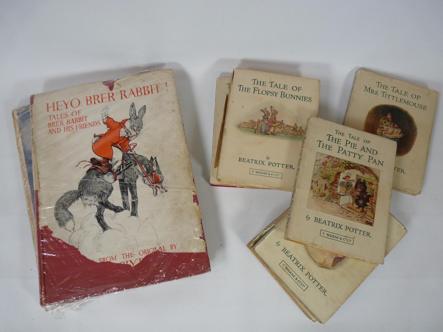 Seven Beatrix Potter books by F Warne and 2 Brier Rabbit books. Condition: Some wear and loss to