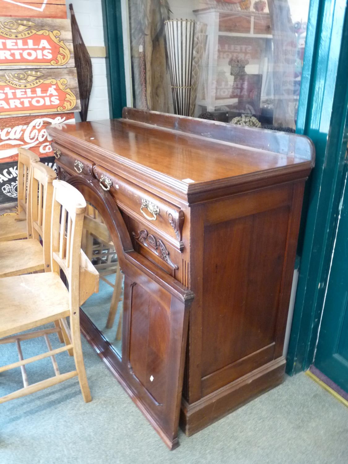 Late Victorian Mahogany sideboard of 2 drawers with cupboard base and a Later domed mirror