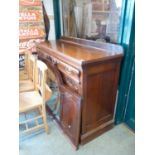 Late Victorian Mahogany sideboard of 2 drawers with cupboard base and a Later domed mirror