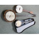 Cased Down South Banjolele and a tenor Banjo 'The New Windsor' and another Banjolele. Condition: