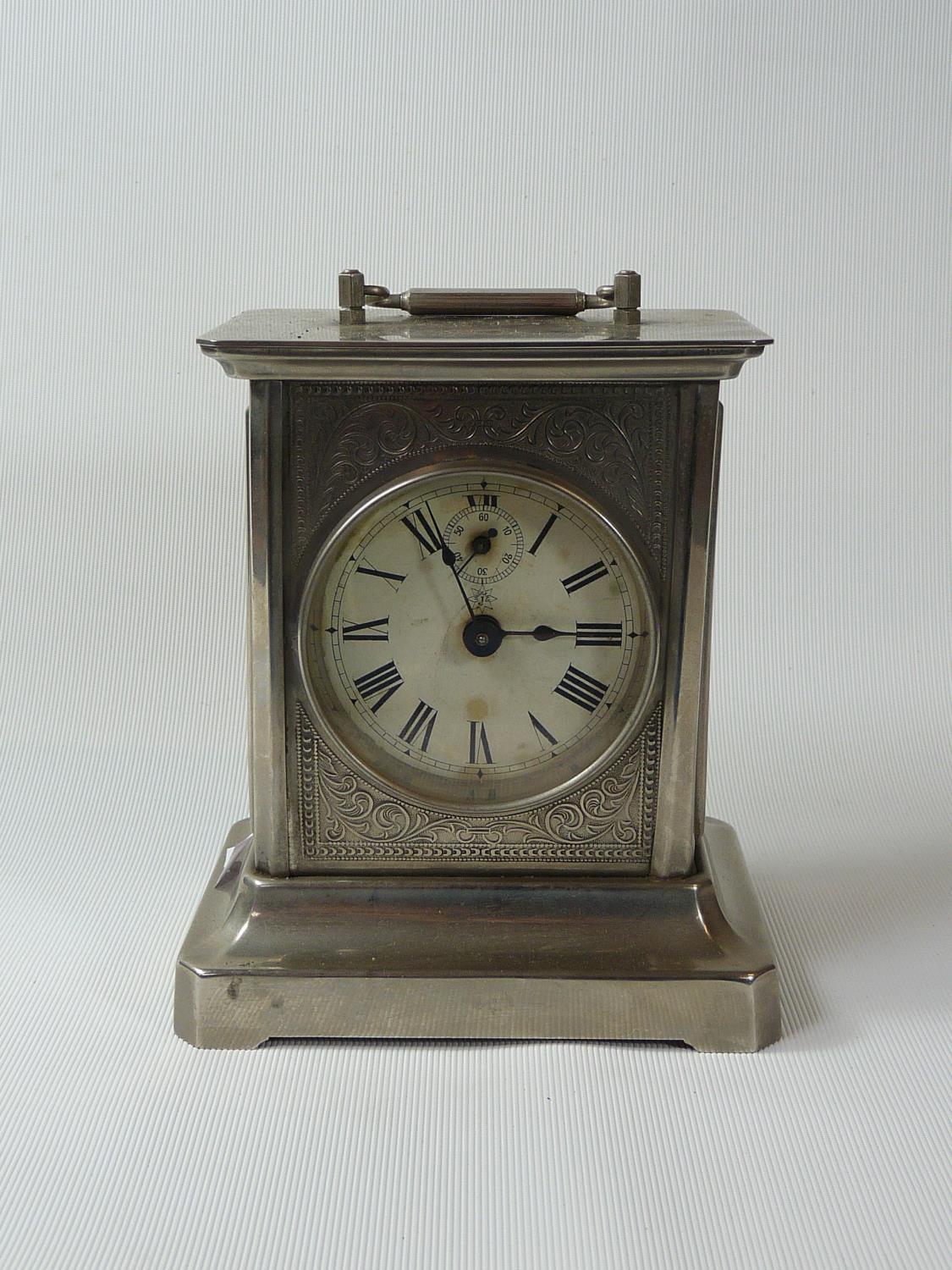 Early 20thC Junghans in white metal foliate decorated case, Roman numeral dial with second dial