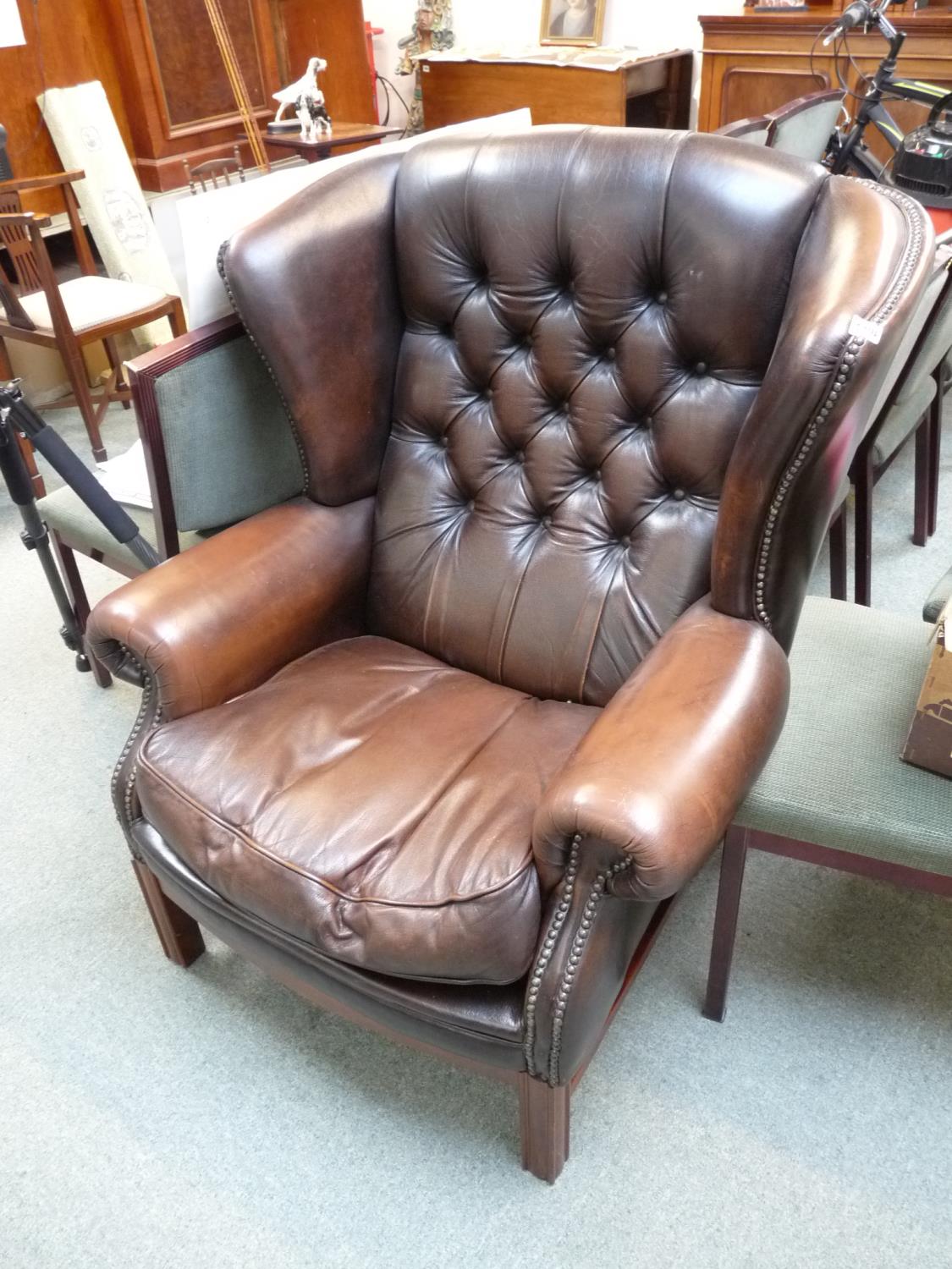 Good Quality 20thC Brown Leather button back Elbow chair with studded detail on wooden base