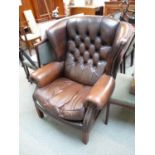 Good Quality 20thC Brown Leather button back Elbow chair with studded detail on wooden base