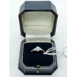 Ladies 18ct White Gold Ring with Oval Claw set Opal flanked by Diamond Shoulders, 2.7g total weight.