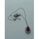 Impressive Ladies 18ct White Gold Drop Pendant of Ruby Setting 2.4ct surrounded by total 1.00ct