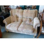 Parker Knoll Paisley upholstered 2 seater sofa on brass casters