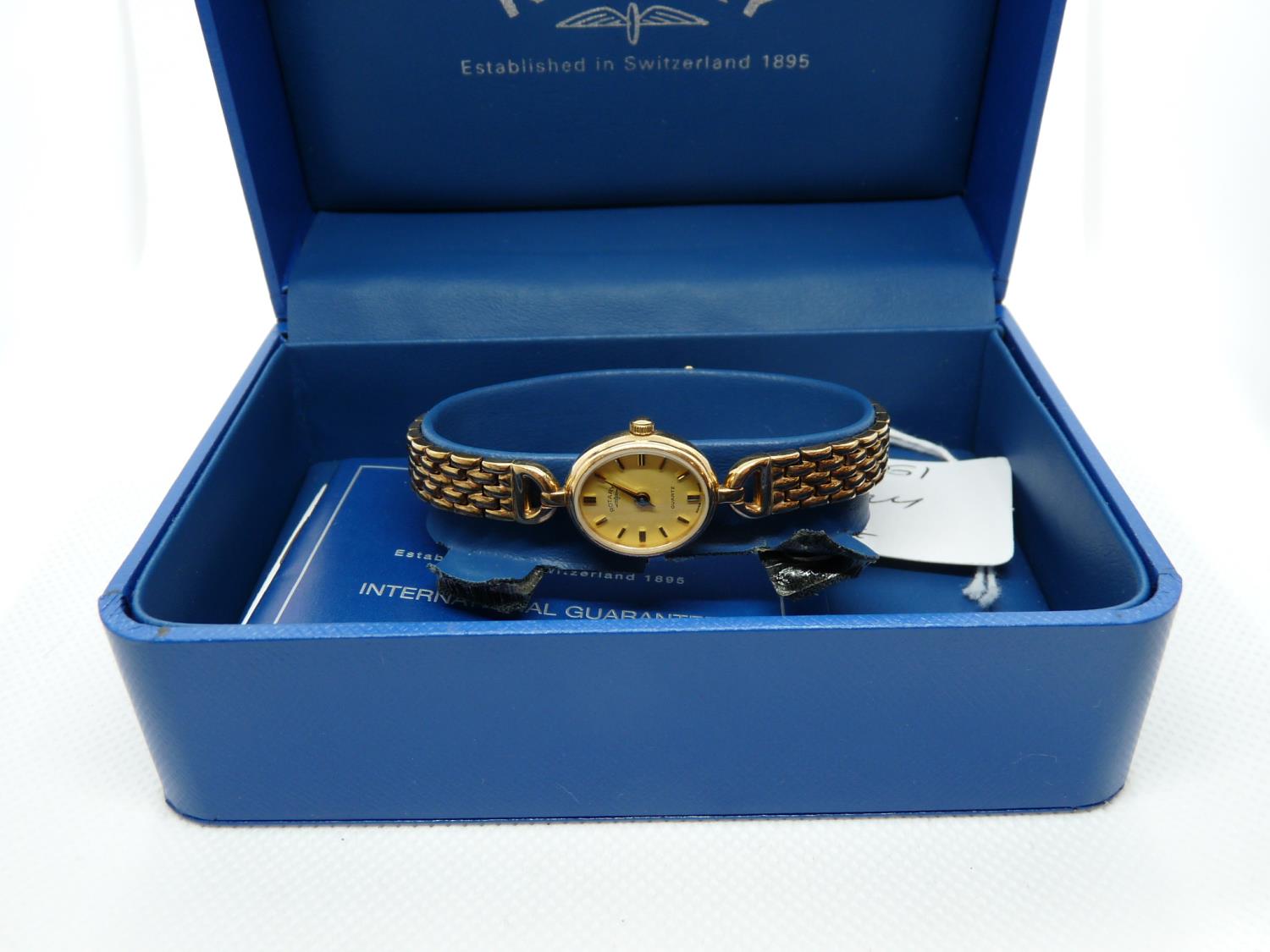 Boxed Ladies 9ct Gold Rotary wristwatch with baton dial, 18g total weight with movement
